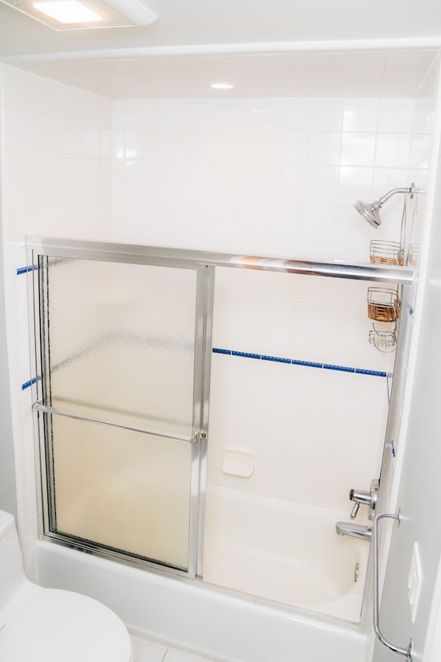 1151 Abseguami Trl, Lake Orion, MI 48362 - full bathroom featuring toilet and shower / bath combination with glass door