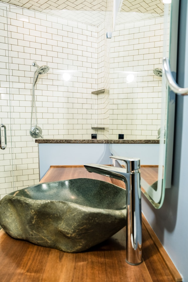 interior space featuring wood finished floors and a stall shower
