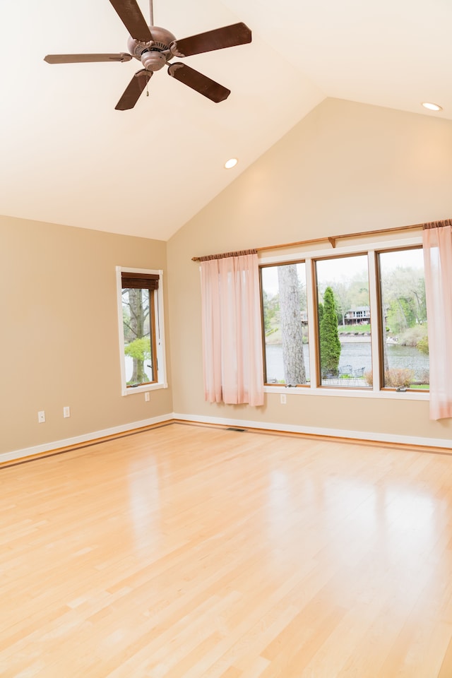 unfurnished room with lofted ceiling, baseboards, recessed lighting, a ceiling fan, and light wood finished floors