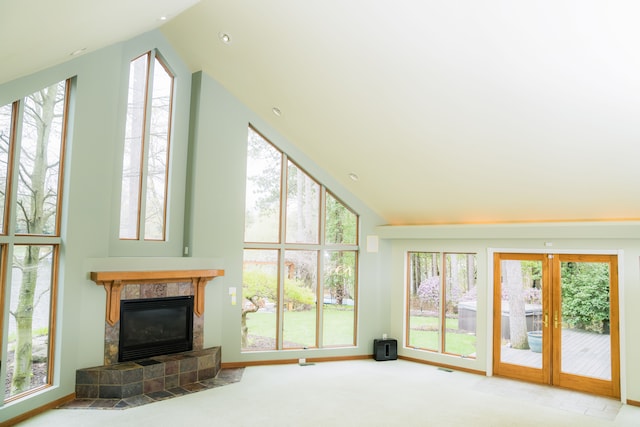 1151 Abseguami Trl, Lake Orion, MI 48362 - living room with a fireplace, plenty of natural light, carpet floors, high vaulted ceiling, and baseboards