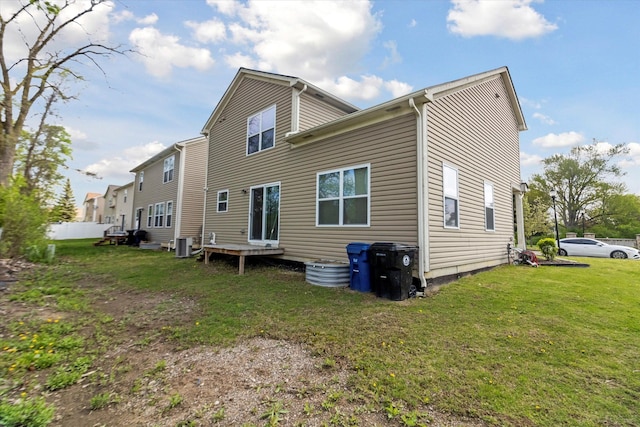 13943 Breakfast Dr, Redford, MI 48239 - back of house featuring a yard and central AC unit