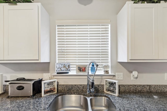 13943 Breakfast Dr, Redford, MI 48239 - kitchen with a sink, white cabinetry, and dark stone countertops