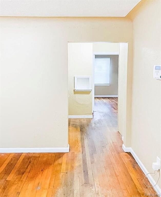 11696 Glastonbury Ave, Detroit, MI 48228 - hallway with light wood finished floors and baseboards