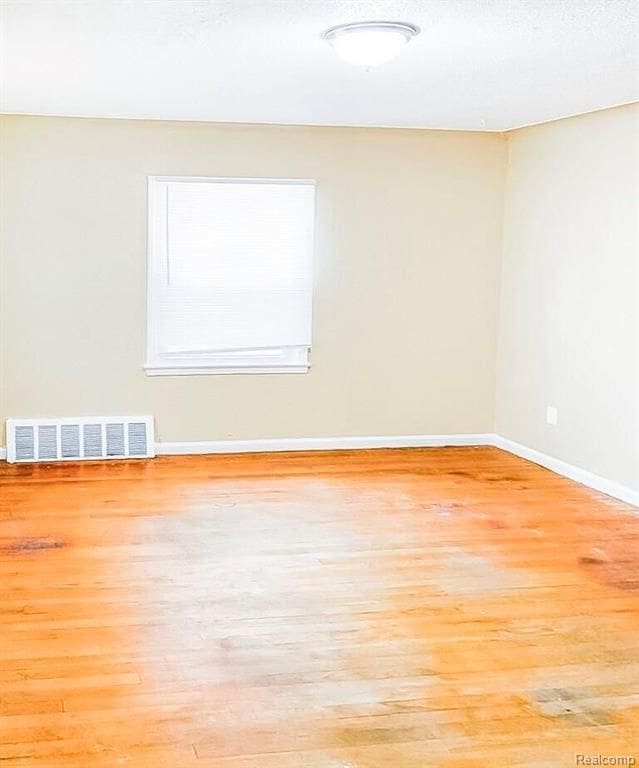 11696 Glastonbury Ave, Detroit, MI 48228 - unfurnished room featuring wood finished floors and baseboards