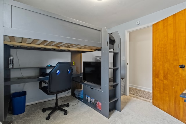 bedroom with carpet, baseboards, and a desk