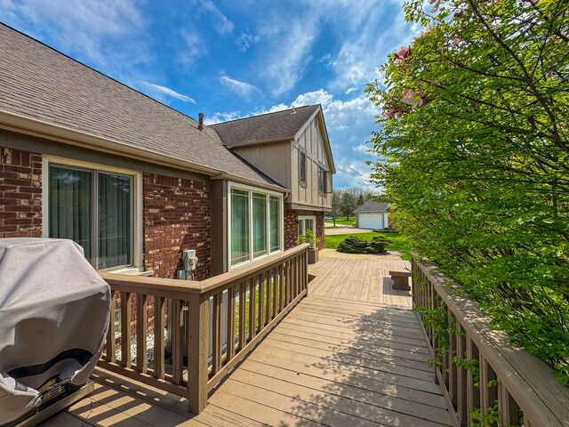 wooden terrace with a grill