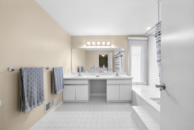 full bath featuring a bathtub, visible vents, tile patterned flooring, vanity, and baseboards