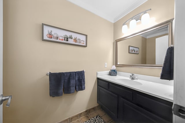 bathroom featuring crown molding, tile patterned floors, and vanity