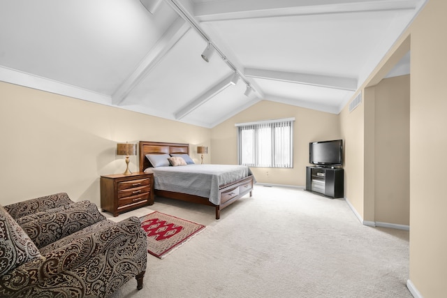 carpeted bedroom with baseboards, rail lighting, visible vents, and vaulted ceiling with beams
