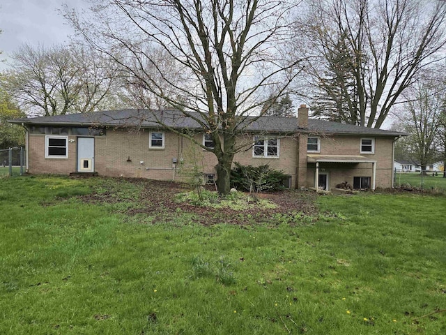 2142 Farnsworth Rd, Lapeer, MI 48446 - back of house with brick siding and a chimney