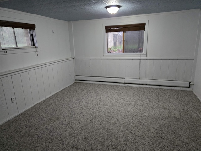 2142 Farnsworth Rd, Lapeer, MI 48446 - unfurnished room featuring plenty of natural light, carpet floors, a baseboard heating unit, and a wainscoted wall