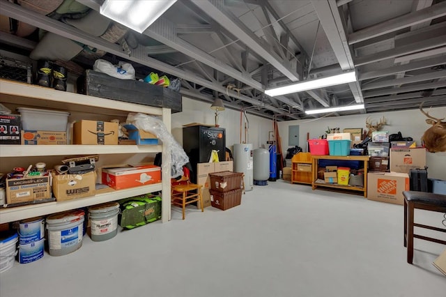 storage area with electric water heater and electric panel