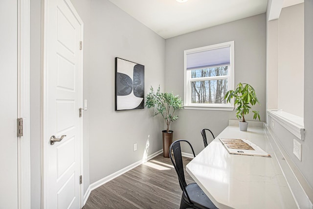 office featuring dark wood-type flooring and baseboards