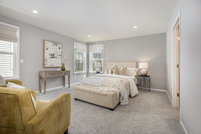carpeted bedroom featuring baseboards and recessed lighting