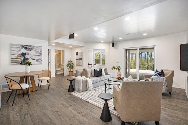 living room with recessed lighting, baseboards, visible vents, and dark wood-style floors
