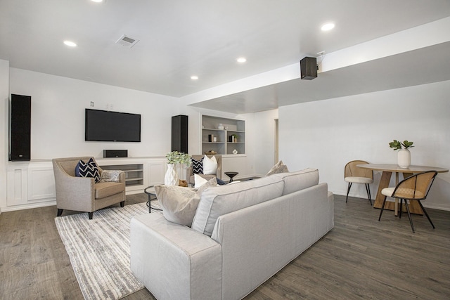 living area featuring visible vents, recessed lighting, and wood finished floors