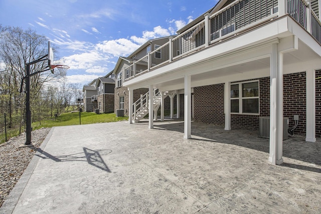 exterior space featuring central AC and a balcony