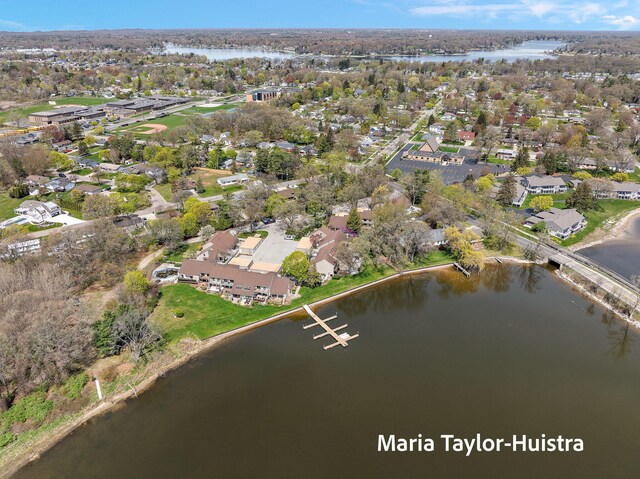 drone / aerial view featuring a water view and a residential view