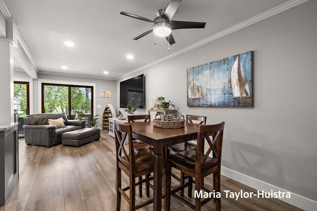 dining space featuring light wood-style floors, recessed lighting, crown molding, and ceiling fan