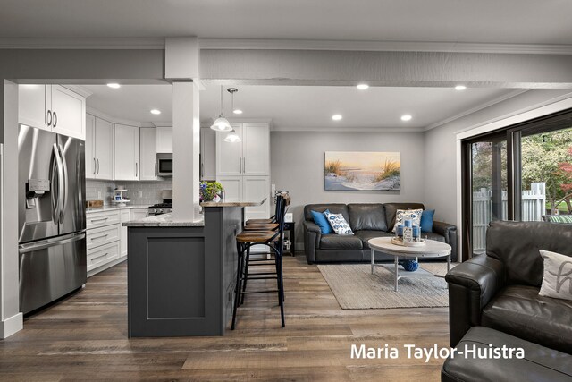 living area featuring recessed lighting, ornamental molding, and dark wood-style flooring