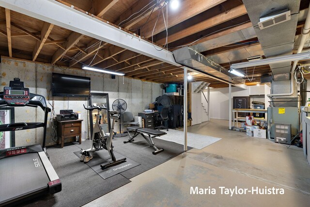 workout room with visible vents and heating unit