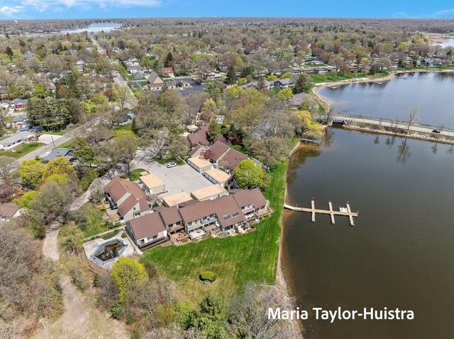 birds eye view of property with a residential view and a water view