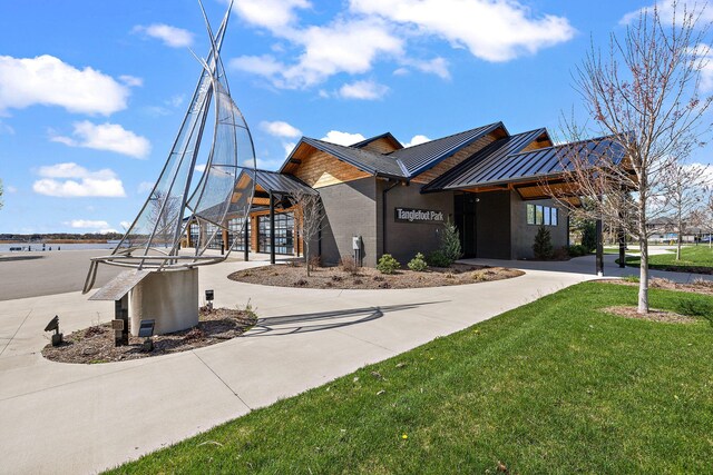 view of building exterior with curved driveway