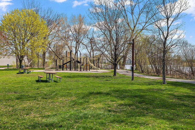 surrounding community featuring a yard and playground community