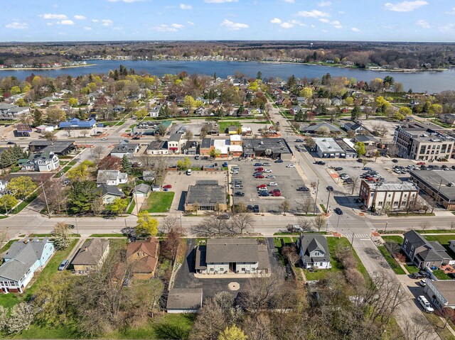 bird's eye view with a water view and a residential view