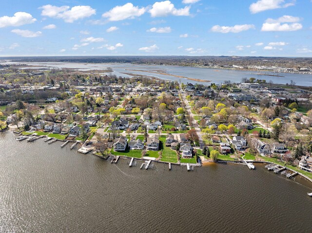 drone / aerial view featuring a water view and a residential view