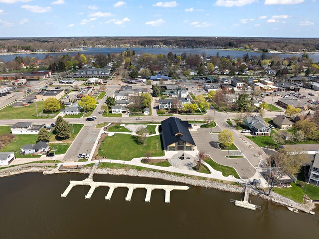 drone / aerial view with a residential view and a water view