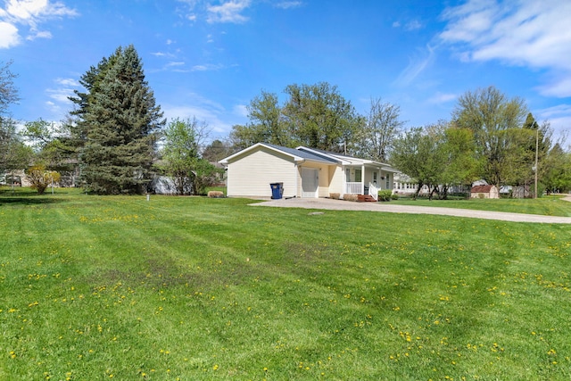 exterior space with a porch, driveway, and a front yard