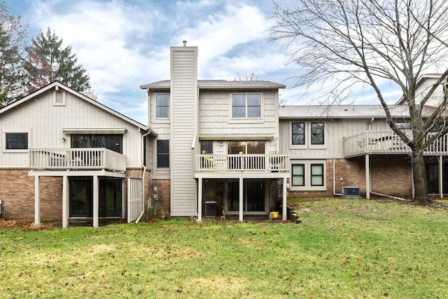 2204 Rivenoak Ct, Ann Arbor, MI 48103 - back of property featuring a lawn, brick siding, and a chimney