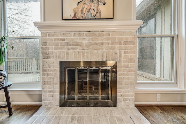 2204 Rivenoak Ct, Ann Arbor, MI 48103 - room details with baseboards, a fireplace, and wood finished floors
