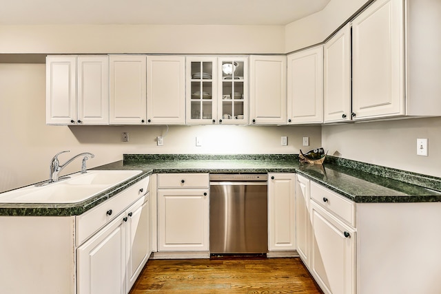2204 Rivenoak Ct, Ann Arbor, MI 48103 - kitchen with dark countertops, a sink, dishwasher, white cabinetry, and dark wood-type flooring