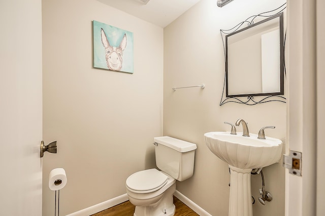 2204 Rivenoak Ct, Ann Arbor, MI 48103 - bathroom with toilet, baseboards, and wood finished floors