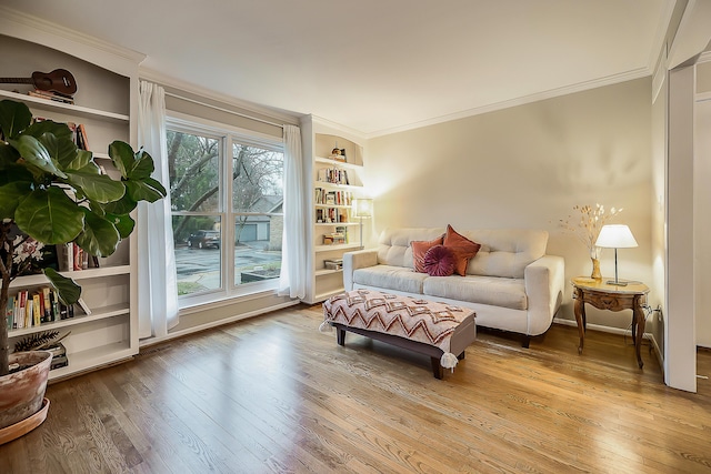 2204 Rivenoak Ct, Ann Arbor, MI 48103 - living area featuring crown molding, built in features, and wood-type flooring