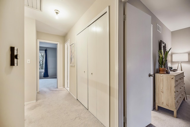 2204 Rivenoak Ct, Ann Arbor, MI 48103 - hallway with baseboards, visible vents, and light colored carpet