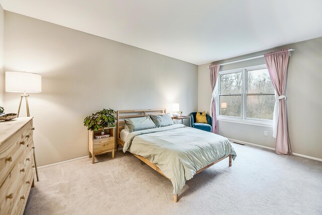 2204 Rivenoak Ct, Ann Arbor, MI 48103 - bedroom with light colored carpet, baseboards, and visible vents