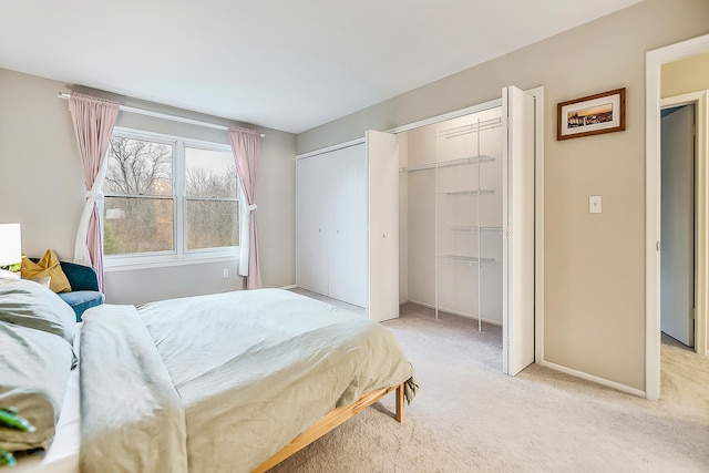 2204 Rivenoak Ct, Ann Arbor, MI 48103 - bedroom with baseboards and light colored carpet