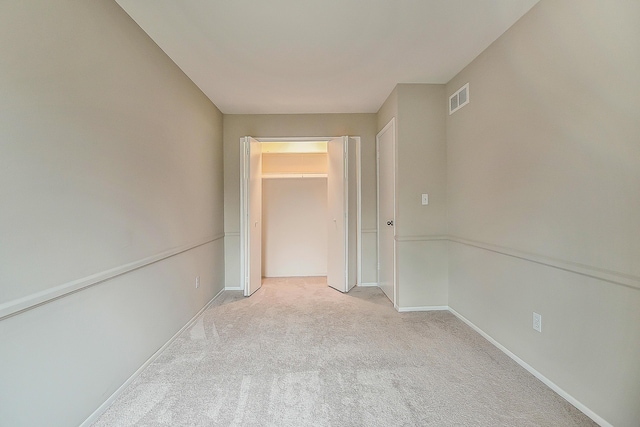 2204 Rivenoak Ct, Ann Arbor, MI 48103 - carpeted spare room featuring visible vents and baseboards