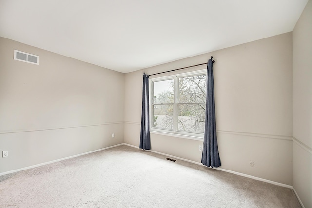 2204 Rivenoak Ct, Ann Arbor, MI 48103 - carpeted spare room featuring baseboards and visible vents