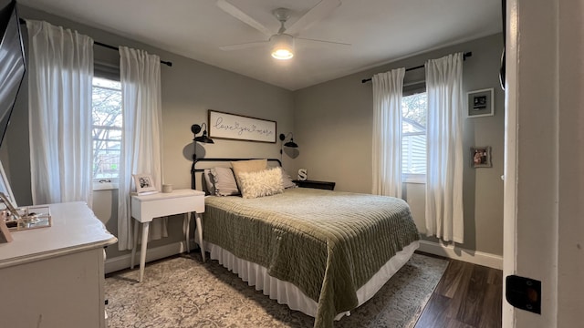 bedroom with baseboards, ceiling fan, and light wood-type flooring
