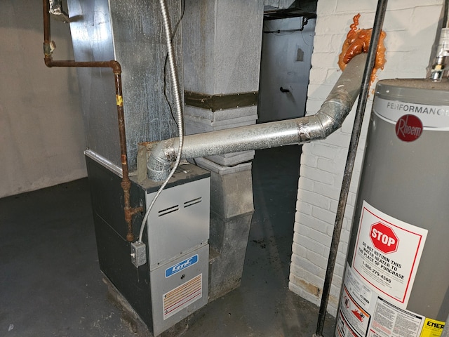 utility room featuring heating unit and water heater
