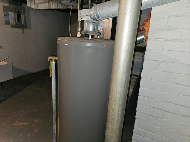 utility room featuring water heater and electric panel