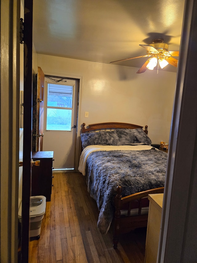 bedroom with ceiling fan and wood-type flooring