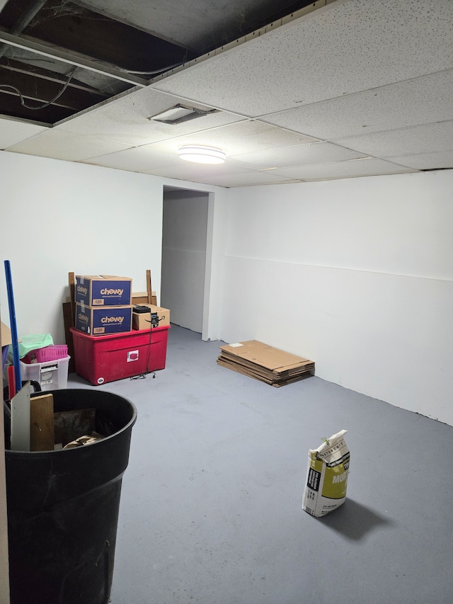 finished below grade area with a paneled ceiling