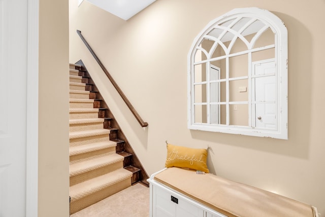 staircase with tile patterned flooring