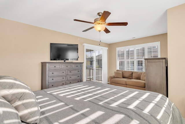 bedroom with ceiling fan, access to exterior, and carpet