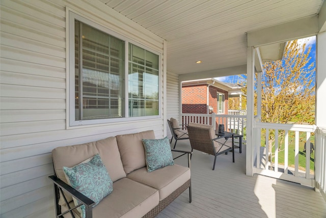 wooden deck featuring an outdoor hangout area